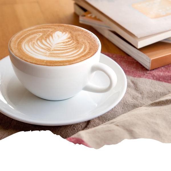 Das Bild zeigt einen Tasse Kaffee und Bücher